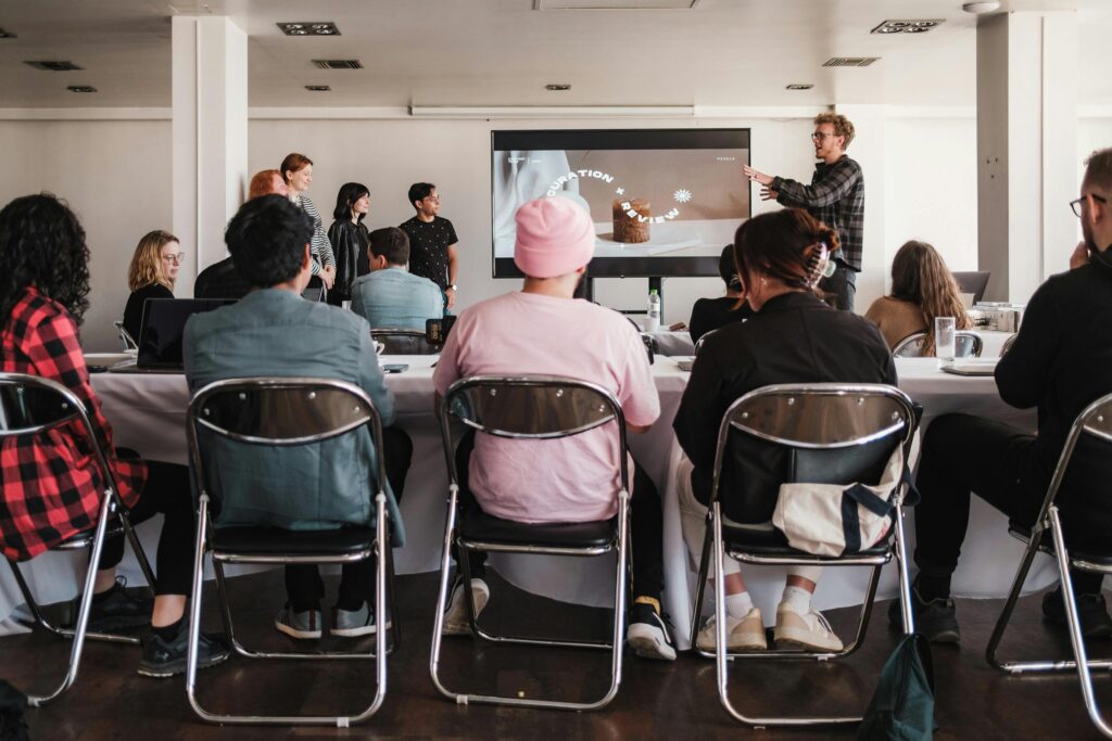 A group of people sitting at tables in a room